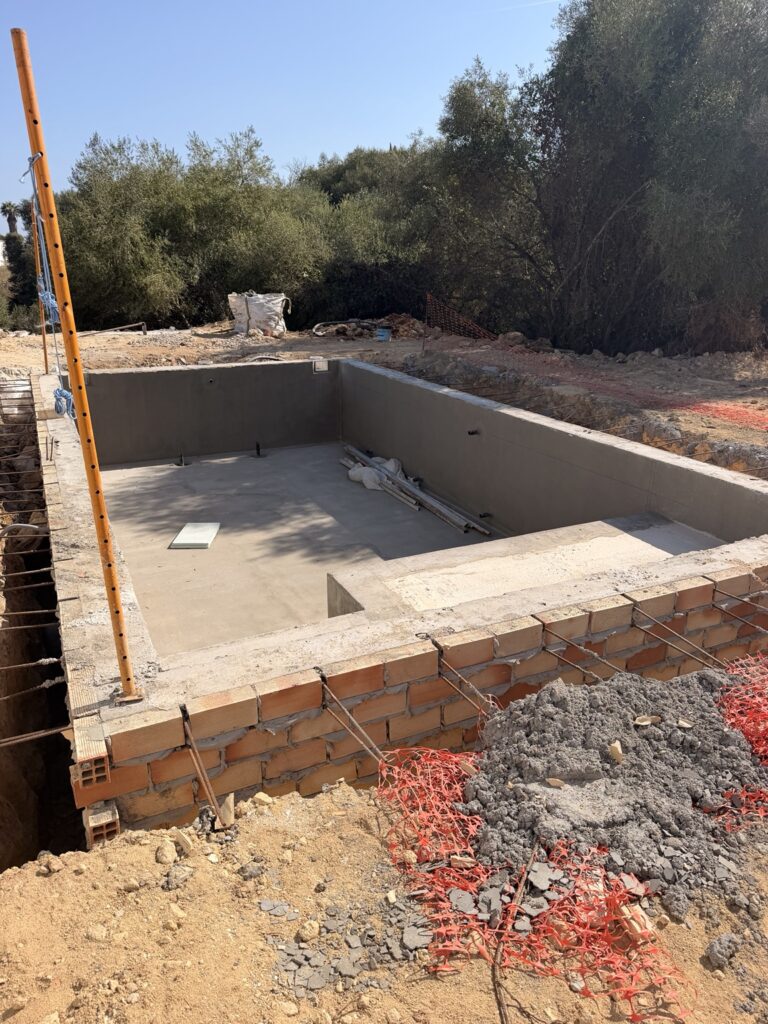 Swimming pool shell under construction before final finishes